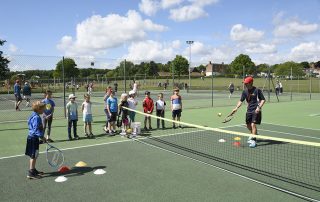 A junior coaching session at Woodbridge Tennis Club