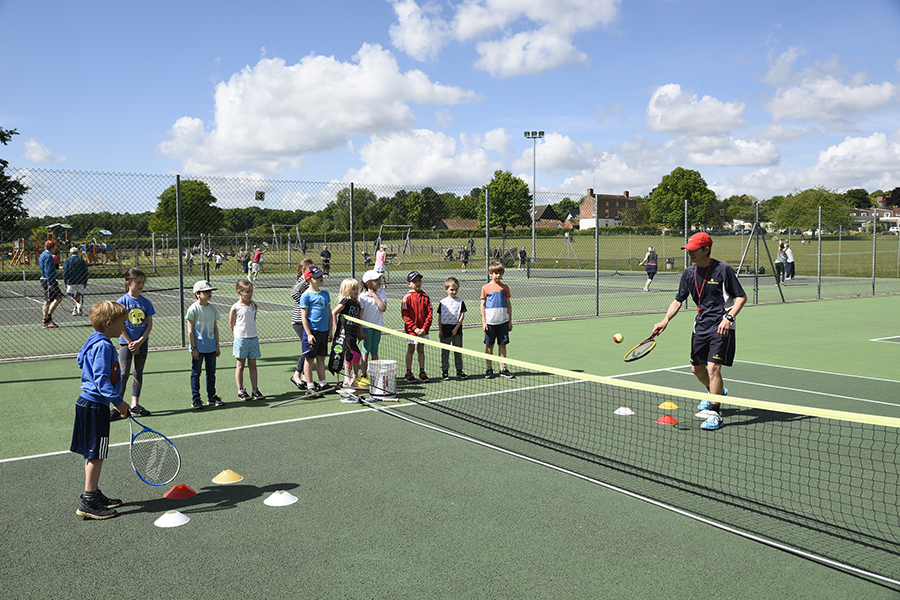 A junior coaching session at Woodbridge Tennis Club