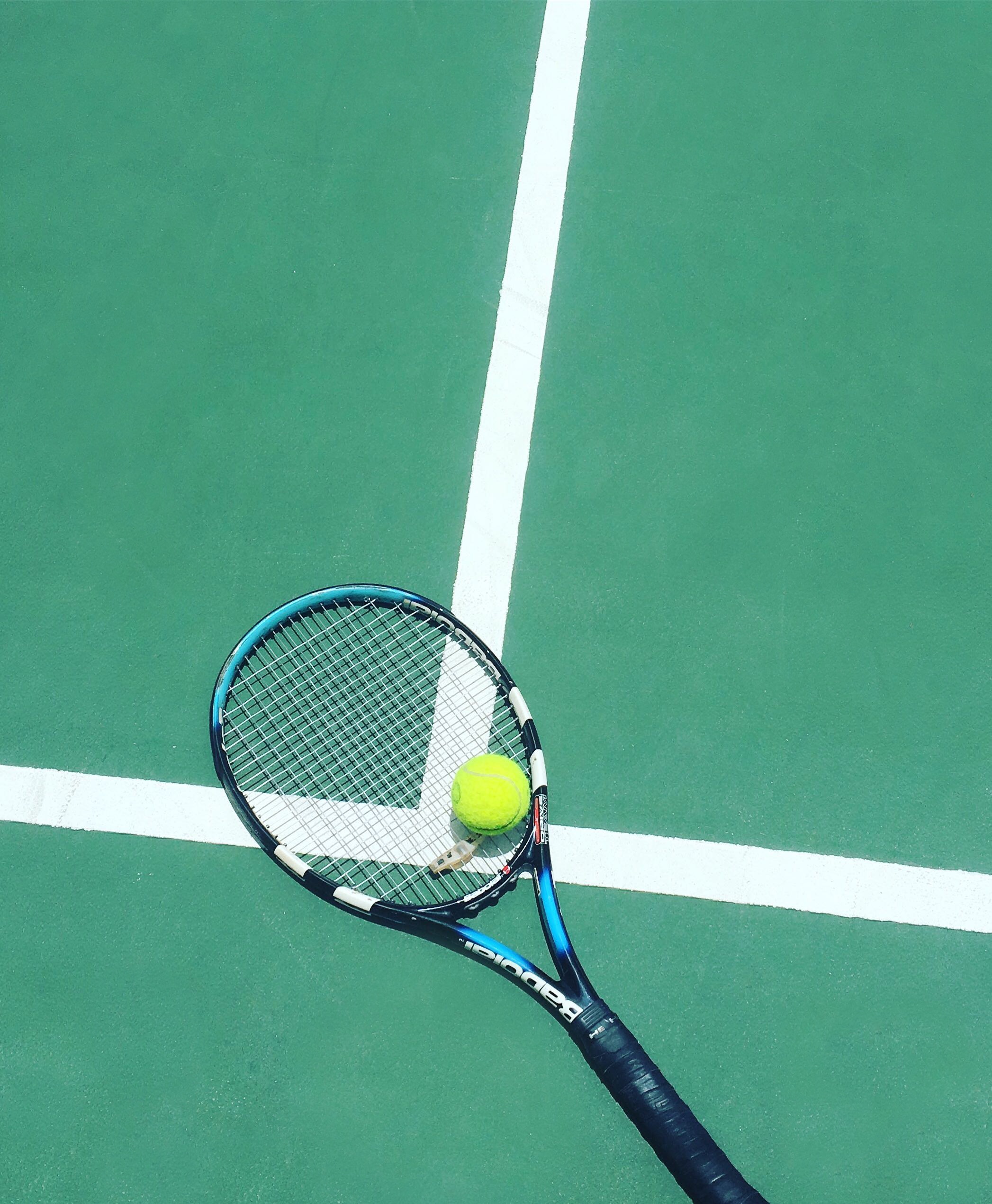 Tennis racket on court