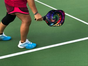 Image of someone holding a Pickleball bat