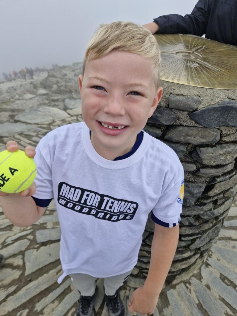 Tom smiling wearing a Woodbridge Mad For Tennis T-Shirt