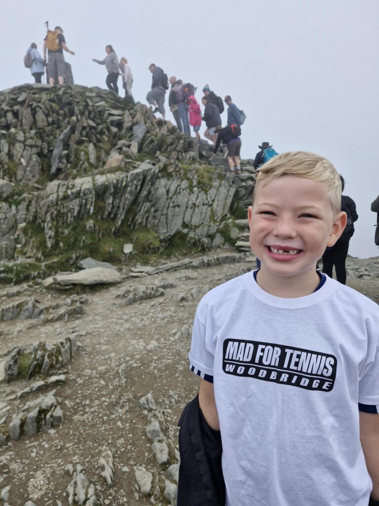 Tom smiling wearing a Woodbridge Mad For Tennis T-Shirt